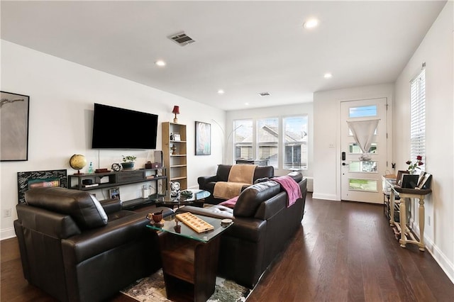 living room with dark hardwood / wood-style flooring