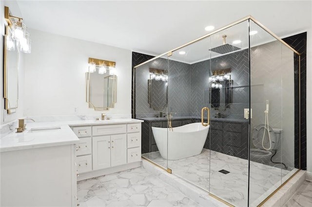 bathroom with vanity and shower with separate bathtub