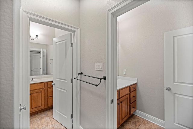 bathroom featuring vanity and tile patterned flooring