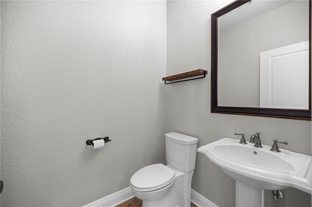 bathroom with sink and toilet