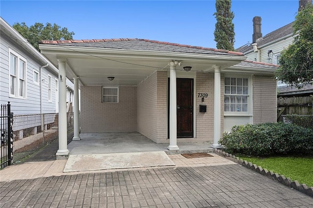 entrance to property with a carport