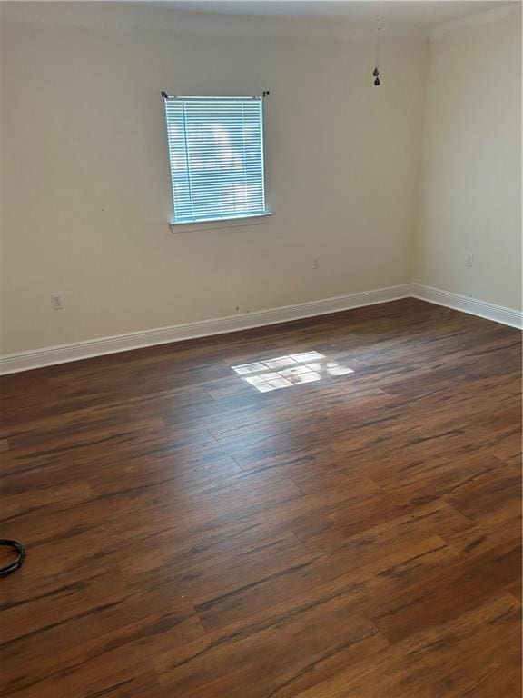 empty room featuring dark wood-type flooring