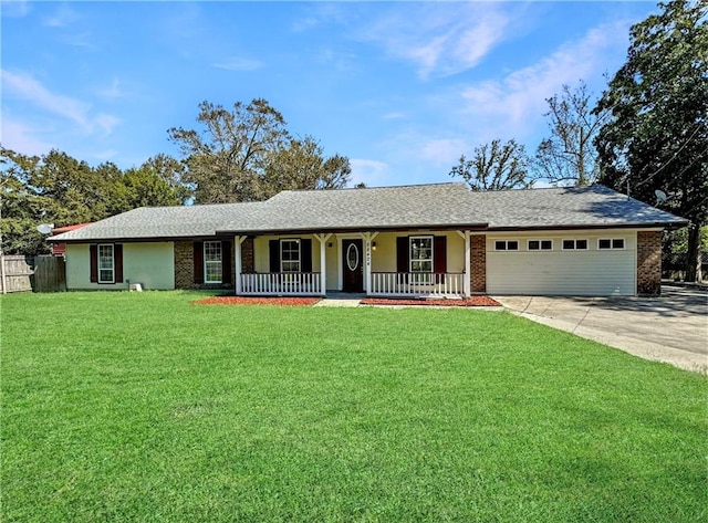 single story home featuring a garage, a front yard, and covered porch