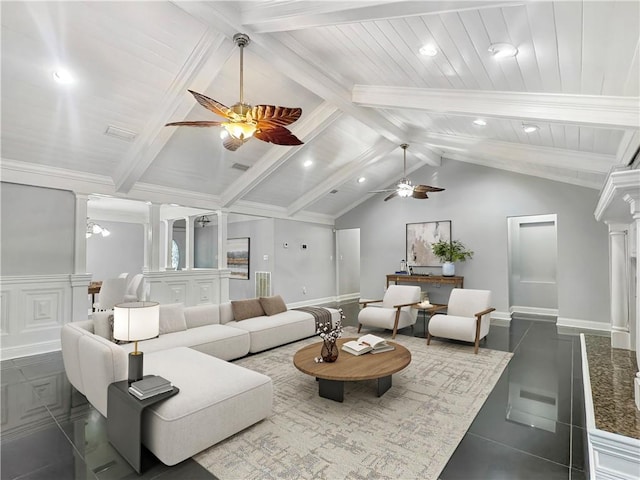 living room with ornate columns, lofted ceiling with beams, ceiling fan, and dark tile patterned floors