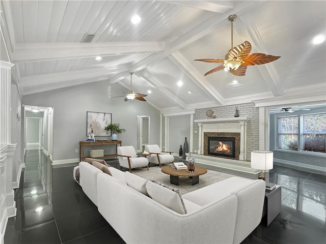 tiled living room with a fireplace and lofted ceiling with beams