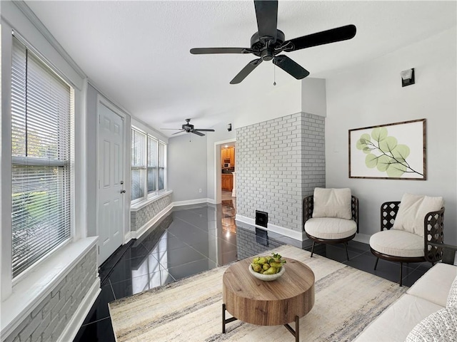 tiled living room featuring ceiling fan