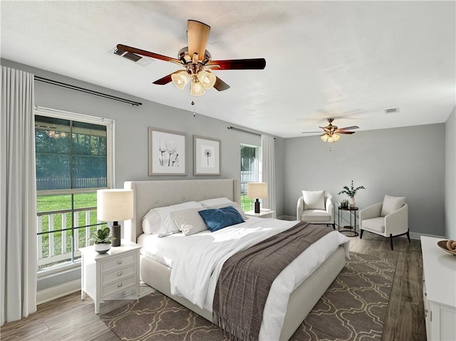 bedroom featuring dark hardwood / wood-style flooring and ceiling fan