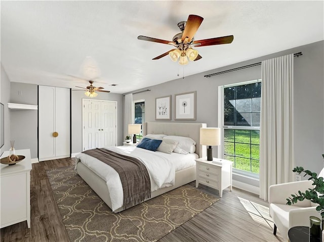 bedroom with hardwood / wood-style floors and ceiling fan