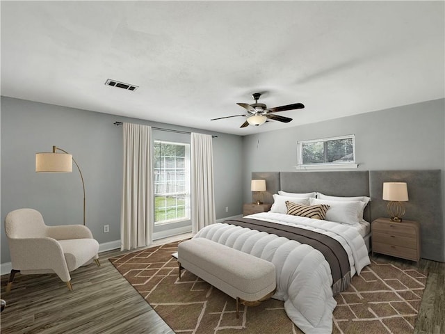 bedroom featuring dark wood-type flooring and ceiling fan