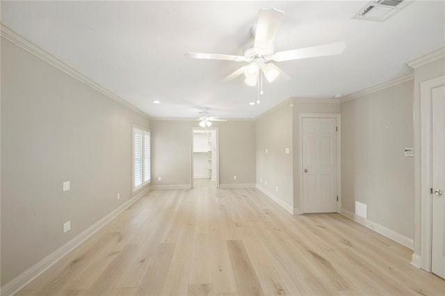 unfurnished room with ceiling fan, crown molding, and light hardwood / wood-style floors