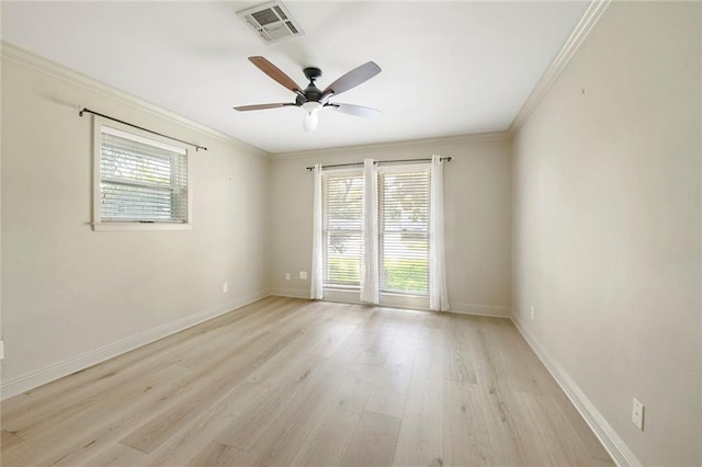 empty room with ceiling fan, light hardwood / wood-style flooring, ornamental molding, and a healthy amount of sunlight