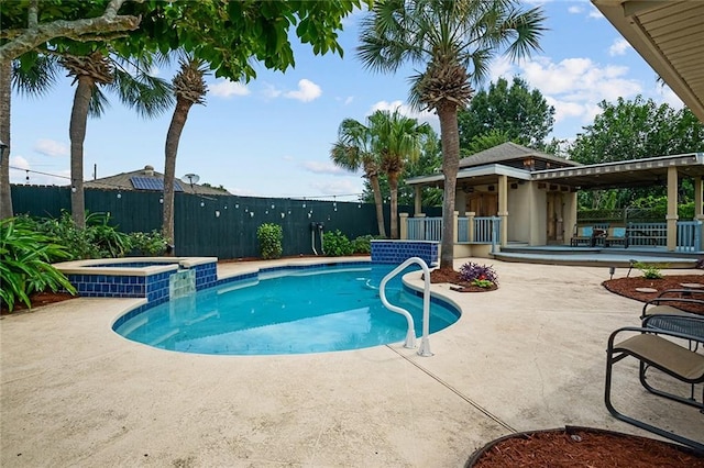 view of swimming pool with an in ground hot tub, a gazebo, and a patio