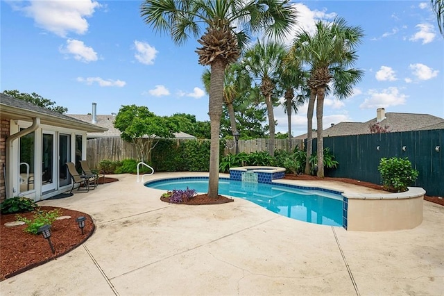 view of pool with an in ground hot tub, french doors, and a patio area