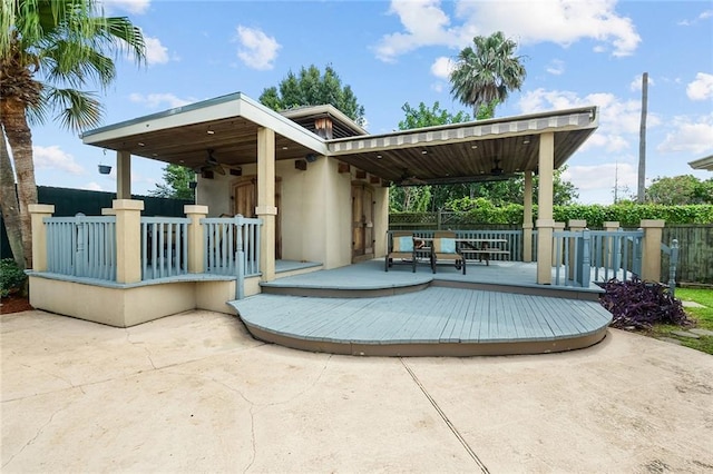 view of pool featuring ceiling fan, a deck, and a patio