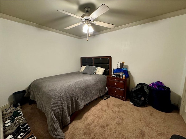 bedroom with ceiling fan, crown molding, and light colored carpet