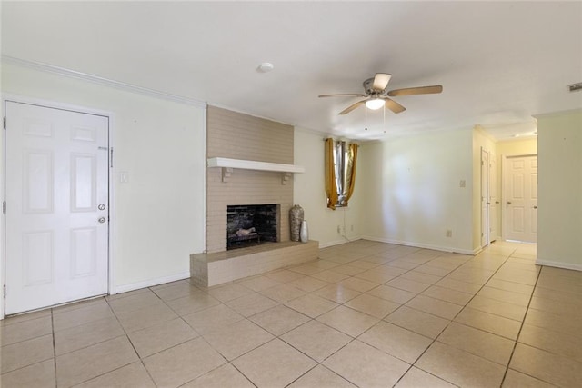 unfurnished living room featuring light tile patterned flooring, a brick fireplace, and ceiling fan