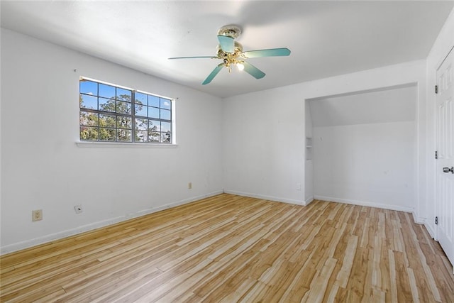 empty room featuring light hardwood / wood-style flooring and ceiling fan