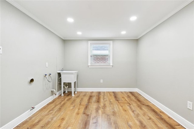 2109 Airline Park Blvd, Metairie, LA 70003 - laundry area featuring washer hookup, light wood finished floors, ornamental molding, recessed lighting, and baseboards