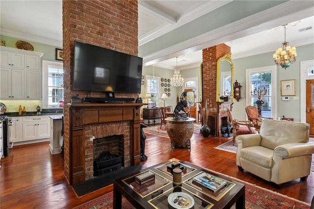 living room featuring beam ceiling, a fireplace, crown molding, and dark wood-type flooring