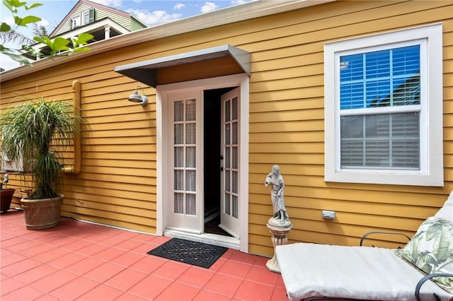 doorway to property with a patio