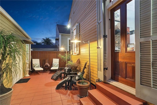 view of patio terrace at dusk