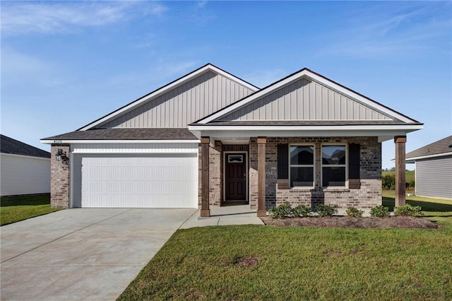 craftsman house featuring a garage and a front yard