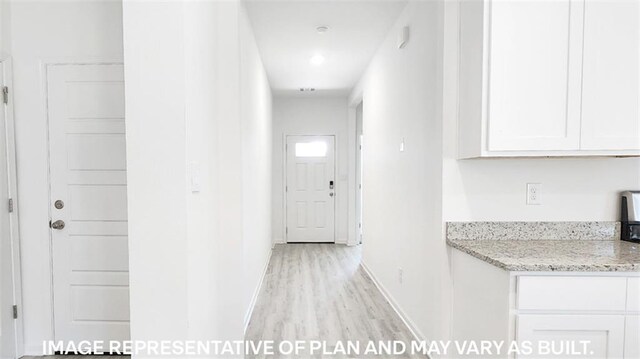 corridor featuring light hardwood / wood-style flooring