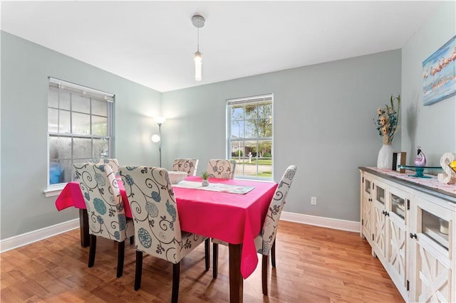 dining space featuring light wood-type flooring