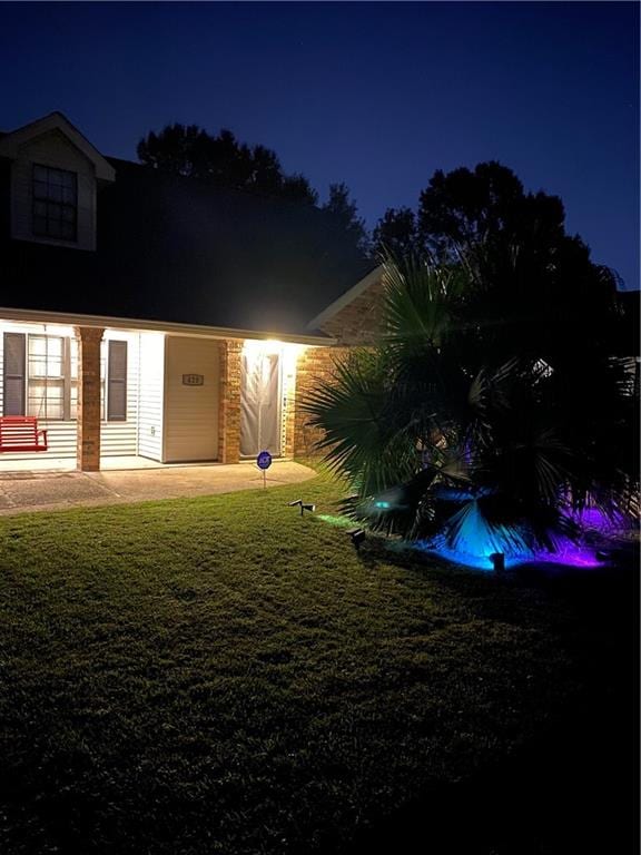 view of yard at twilight