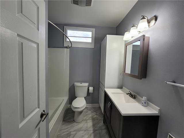 full bathroom featuring shower / bathing tub combination, vanity, and toilet