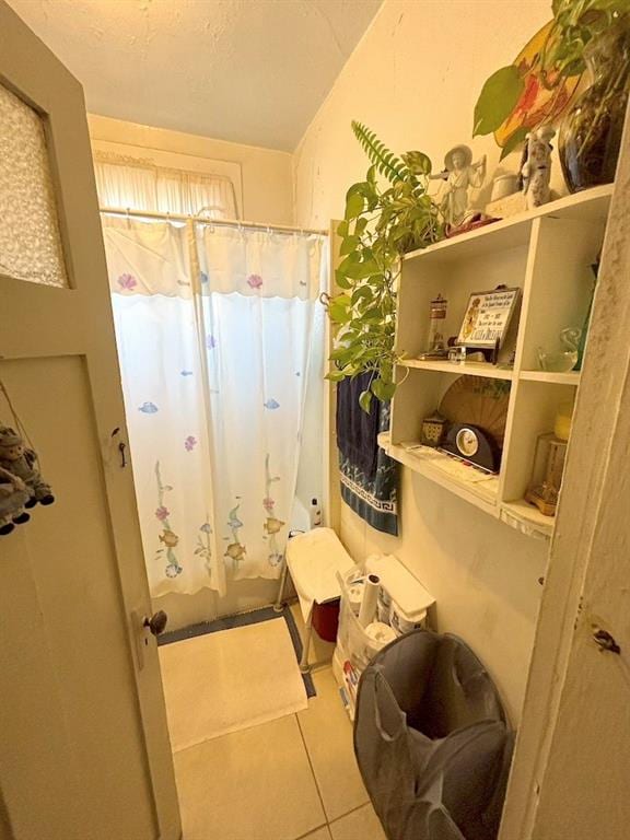 bathroom with tile patterned flooring and a shower with curtain