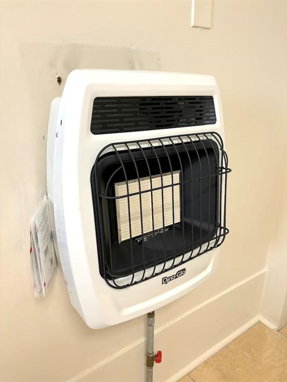 details featuring tile patterned flooring and heating unit