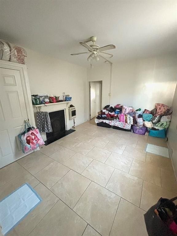 tiled living room featuring ceiling fan