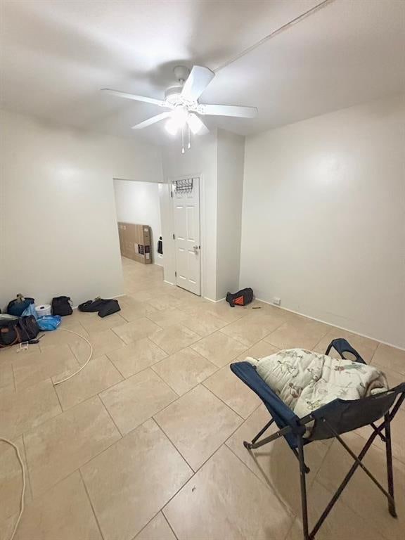 interior space featuring ceiling fan