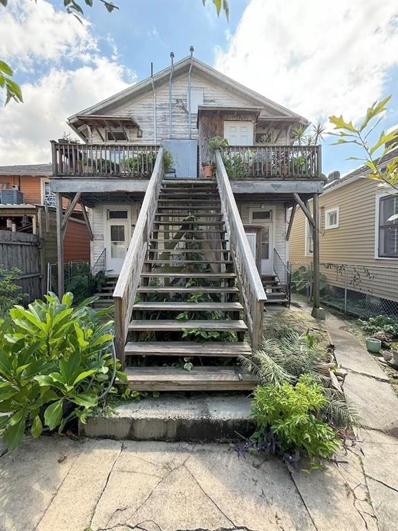 rear view of house with a balcony