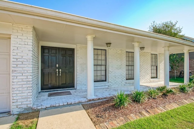 doorway to property with a porch