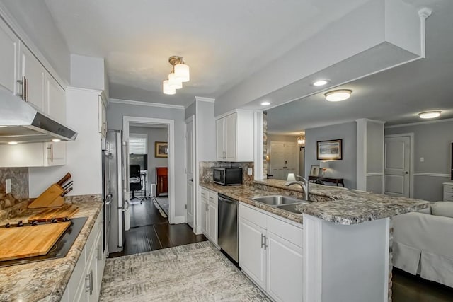 kitchen featuring stainless steel appliances, dark hardwood / wood-style floors, decorative backsplash, and white cabinetry