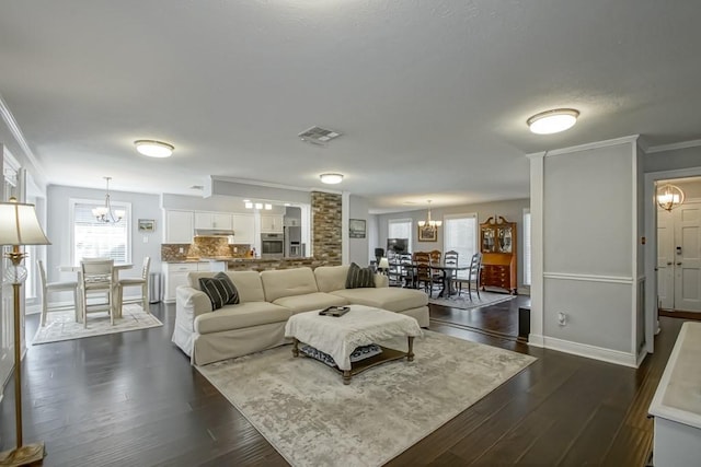 living room with dark hardwood / wood-style floors and ornamental molding