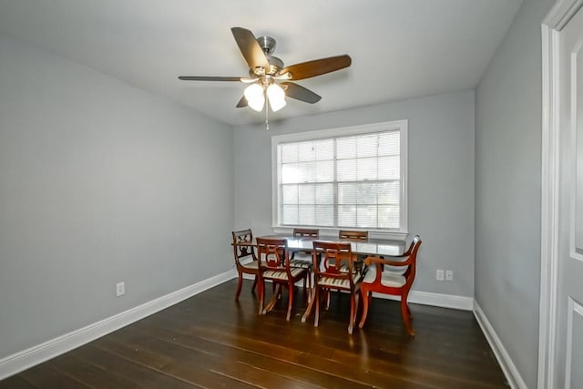 dining area with dark hardwood / wood-style flooring and ceiling fan