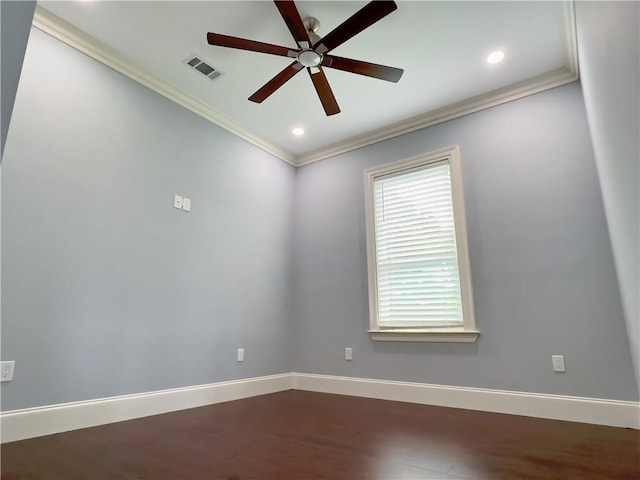 empty room with hardwood / wood-style flooring, ceiling fan, and crown molding