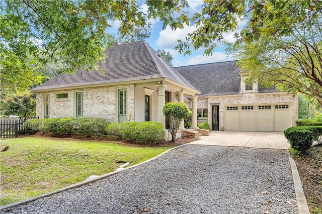 view of front facade featuring a front yard and a garage