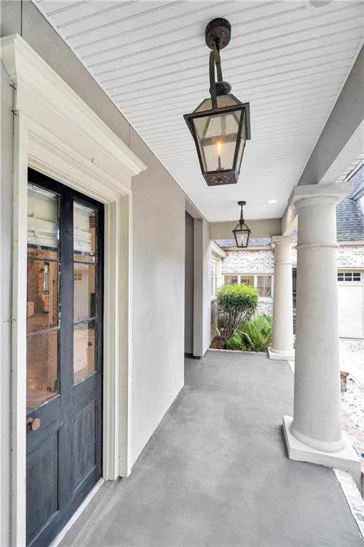 property entrance with french doors and covered porch