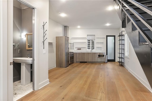 kitchen featuring stainless steel appliances and light wood-type flooring