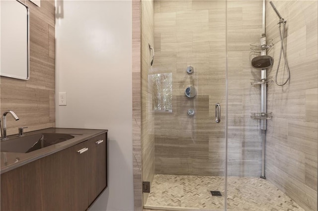 bathroom featuring sink and an enclosed shower