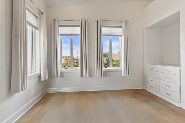 unfurnished room with light hardwood / wood-style floors