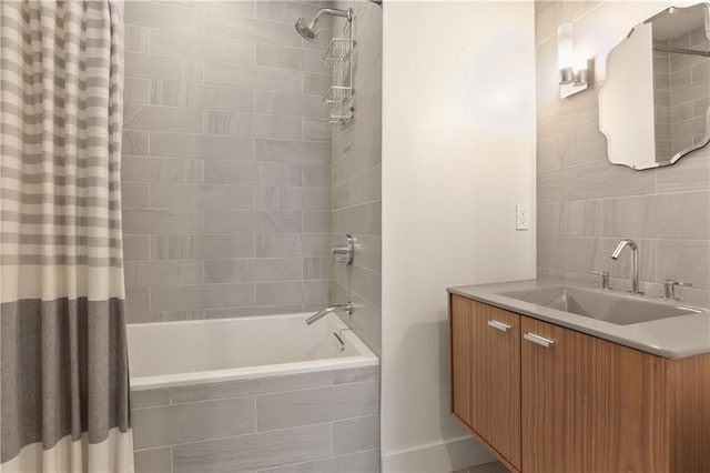 bathroom with shower / tub combo with curtain, vanity, and backsplash