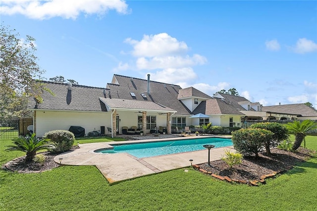 view of pool featuring a yard and a patio area