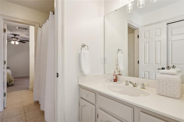 bathroom featuring tile patterned floors, visible vents, a ceiling fan, vanity, and connected bathroom