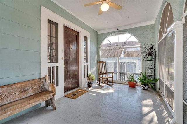 sunroom / solarium with ceiling fan