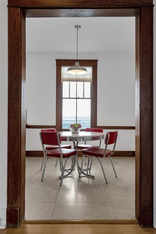 dining space featuring tile patterned flooring